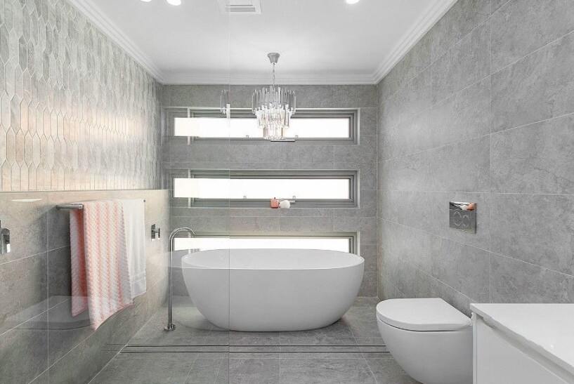 Luxurious bathroom with freestanding tub and textured tile walls at 44 Worrumung Ave, Castle Hill, NSW